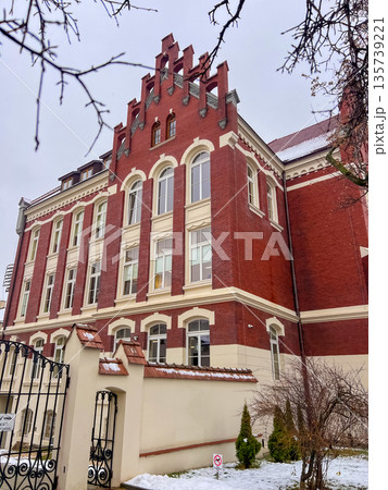 Historic building stands tall in a city during winter 135739221