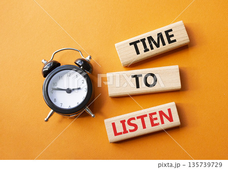 Time to listen symbol. Concept words Time to listen on wooden blocks. Beautiful orange background with alarm clock. Business and Time to listen concept. Copy space. Time to listen symbol. Concept words Time to listen on wooden blocks. Beautiful orange background with alarm clock. Business and Time to listen concept. Copy space. 135739729