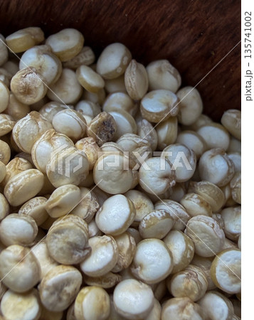 Dry Quinoa Macro Texture with Wooden Spoon 135741002