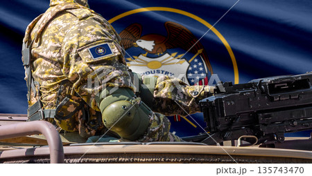 Utah US state flag with soldier at machinegun turret 135743470