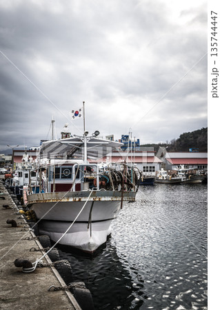 Resting and fishing boats at Naksan Port 135744447