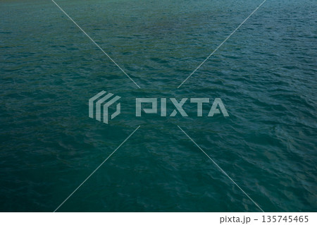 Indian ocean water background in bay on Seychelles islands Indian ocean water background in bay on Seychelles islands 135745465