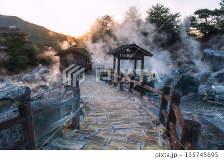 Hell valley Jigoku of Mount Unzen with gas at sunset, Nagasaki Hell valley Jigoku of Mount Unzen with gas at sunset, Nagasaki 135745695