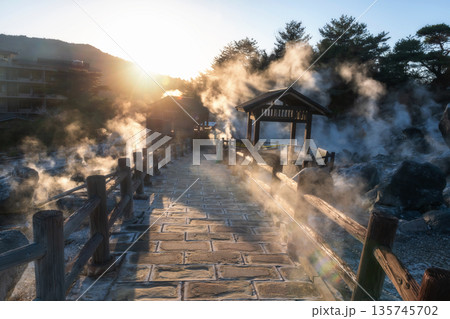 Walking trail with gas in Mount Unzen and hot springs at sunset, Nagasaki Walking trail with gas in Mount Unzen and hot springs at sunset, Nagasaki 135745702