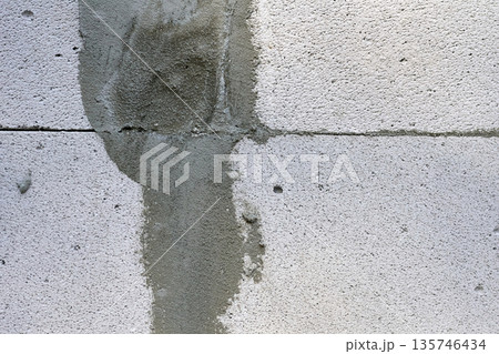 Joint between two concrete blocks, sealed with cement Joint between two concrete blocks, sealed with cement 135746434