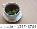 A cup of fresh tea from Melissa officinalis, commonly known as lemon balm or melissa. 135746784
