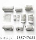 Neutral Tones Artistic Arrangement of Textured Paper Rolls for Creative Projects 135747083