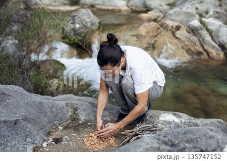 young pretty brunette girl hiking to waterfall, lifestyle people concept young pretty brunette girl hiking to waterfall, lifestyle people concept 135747152