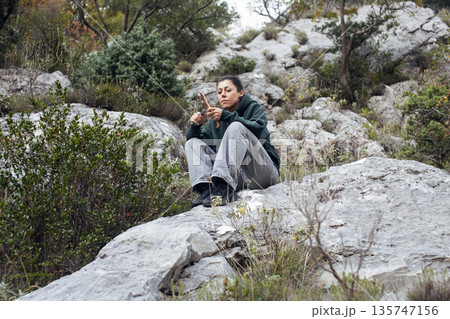 young pretty brunette girl hiking to waterfall, lifestyle people concept young pretty brunette girl hiking to waterfall, lifestyle people concept 135747156
