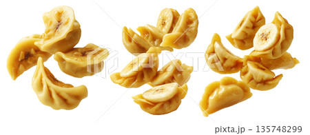 Set of Steamed Banana dumplings with intricate twisted edges, isolated on white background. Concept of Asian cuisine and food art Set of Steamed Banana dumplings with intricate twisted edges, isolated on white background. Concept of Asian cuisine and food art 135748299