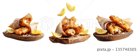 Set of Battered fish fillets  wrapped in paper with lemon wedges on wooden board on white background. Australia Fish and Chips 135748305
