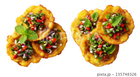 Colombia Patacones fried green plantains slices garnished with chopped onions, chili, and herbs isolated on white background 135748326