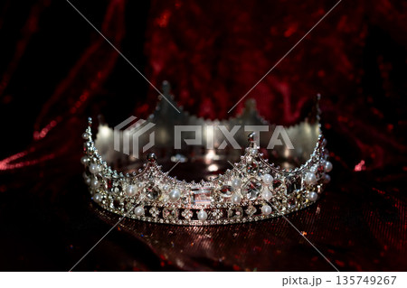 Ancient golden medieval crown with gemstones. 135749267