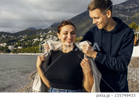 young caucasian couple tourists having fun on sea side, lifestyle people concept 135749433