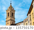 Historic clock tower in the old center of Vitoria Gasteiz, Basque Country, Spain. Bright blue sky 135750170