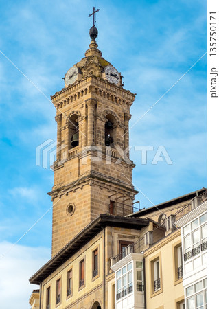 Historic clock tower in the old center of Vitoria Gasteiz, Basque Country, Spain. Bright blue sky Historic clock tower in the old center of Vitoria Gasteiz, Basque Country, Spain. Bright blue sky 135750171