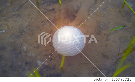 White golf ball falls into the water one of the obstacles to playing golf White golf ball falls into the water one of the obstacles to playing golf 135752726