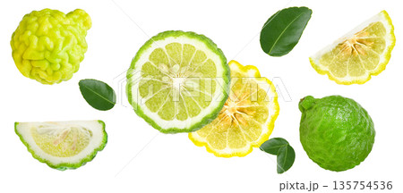 Organic kaffir lime fruits, yellow lime slices, and kaffir lime leaves arranged beautifully, natural citrus ingredient for cooking and wellness on white background. Organic kaffir lime fruits, yellow lime slices, and kaffir lime leaves arranged beautifully, natural citrus ingredient for cooking and wellness on white background. 135754536
