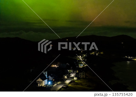 The Aurora Borealis, the northern lights, showing up above Portnoo in County Donegal, Ireland 135755420