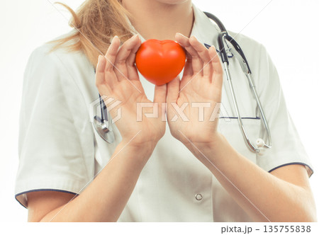 Hand of doctor holding red heart. Health care and treatment Hand of doctor holding red heart. Health care and treatment 135755838