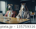Two people in zebra masks sitting at office desk with laptop, concept of creativity 135759316