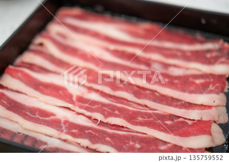 Close up of sliced raw meat. prepared for cooking Close up of sliced raw meat. prepared for cooking 135759552