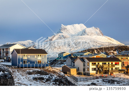 Residential architecture in arctic environment with snow covered Sermitsiaq mountain and clear winter light, highlighting northern urban landscape, Nuuk, Greenland 135759930
