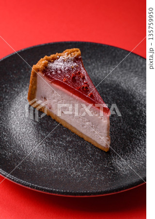 Strawberry cheesecake, a slice of sweet pie, a classic cheesecake dessert. Strawberry cheesecake 135759950