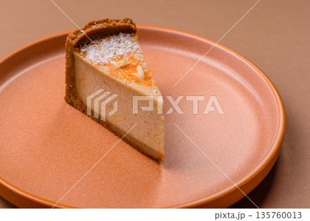 Cheesecake, a slice of sweet pie, a classic cheese dessert. Cheesecake as a food background 135760013