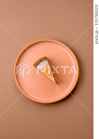 Cheesecake, a slice of sweet pie, a classic cheese dessert. Cheesecake as a food background Cheesecake, a slice of sweet pie, a classic cheese dessert. Cheesecake as a food background 135760020