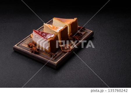 Cheesecake, a slice of sweet pie, a classic cheese dessert. Cheesecake as a food background 135760242