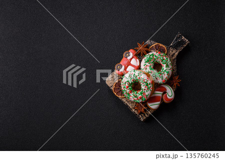 Christmas donuts or doughnuts, holiday winter sweets with sprinkles. Christmas donuts 135760245