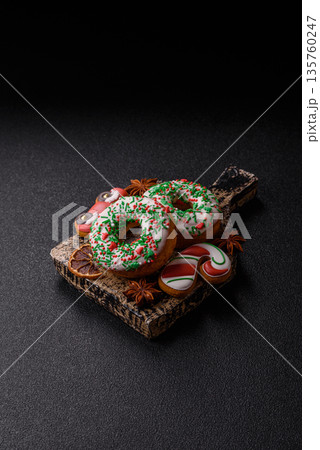Christmas donuts or doughnuts, holiday winter sweets with sprinkles. Christmas donuts 135760247
