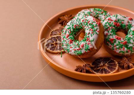 Christmas donuts or doughnuts, holiday winter sweets with sprinkles. Christmas donuts 135760280