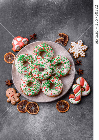 Christmas donuts or doughnuts, holiday winter sweets with sprinkles. Christmas donuts 135760322