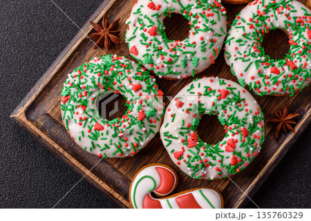 Christmas donuts or doughnuts, holiday winter sweets with sprinkles. Christmas donuts 135760329