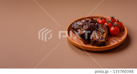 Grilled or bbq pork ribs with sauce, a food prepared for dinner. Grilled ribs 135760398