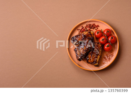 Grilled or bbq pork ribs with sauce, a food prepared for dinner. Grilled ribs Grilled or bbq pork ribs with sauce, a food prepared for dinner. Grilled ribs 135760399