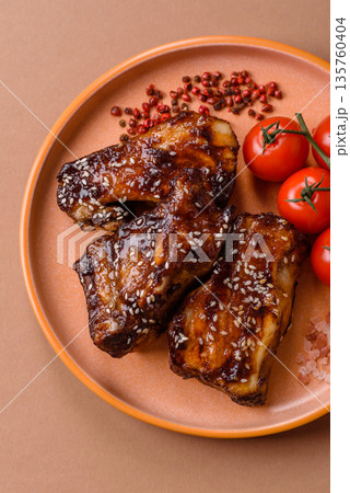 Grilled or bbq pork ribs with sauce, a food prepared for dinner. Grilled ribs Grilled or bbq pork ribs with sauce, a food prepared for dinner. Grilled ribs 135760404