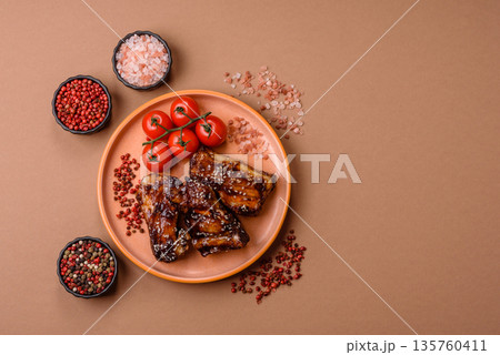 Grilled or bbq pork ribs with sauce, a food prepared for dinner. Grilled ribs 135760411