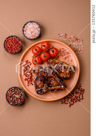 Grilled or bbq pork ribs with sauce, a food prepared for dinner. Grilled ribs Grilled or bbq pork ribs with sauce, a food prepared for dinner. Grilled ribs 135760412