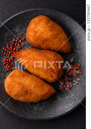 Chicken Kyiv cutlet with buttery filling, a lunch of chicken breast meat. Chicken Kyiv 135760467