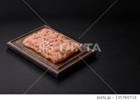Raw ground chicken for burgers and other food. Raw minced chicken meat 135760718