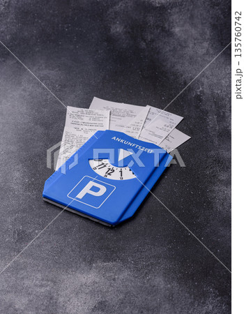 A parking disc, permit, or ticket for measuring time and paying municipal services. A parking disc A parking disc, permit, or ticket for measuring time and paying municipal services. A parking disc 135760742