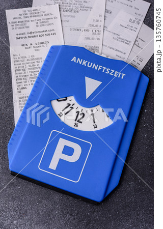 A parking disc, permit, or ticket for measuring time and paying municipal services. A parking disc A parking disc, permit, or ticket for measuring time and paying municipal services. A parking disc 135760745