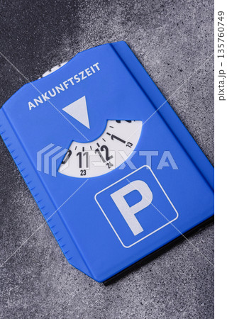 A parking disc, permit, or ticket for measuring time and paying municipal services. A parking disc A parking disc, permit, or ticket for measuring time and paying municipal services. A parking disc 135760749