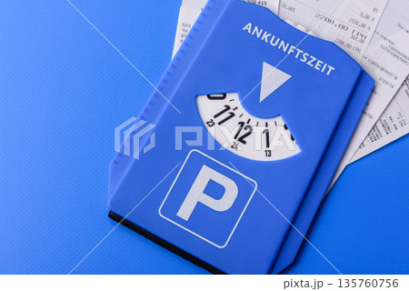 A parking disc, permit, or ticket for measuring time and paying municipal services. A parking disc 135760756