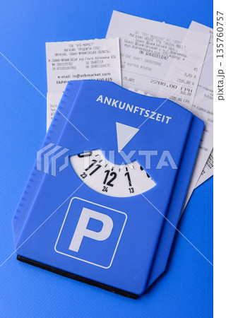 A parking disc, permit, or ticket for measuring time and paying municipal services. A parking disc A parking disc, permit, or ticket for measuring time and paying municipal services. A parking disc 135760757