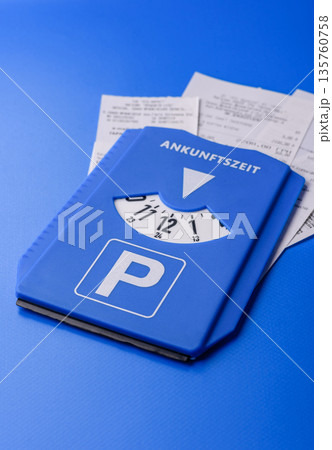 A parking disc, permit, or ticket for measuring time and paying municipal services. A parking disc 135760758
