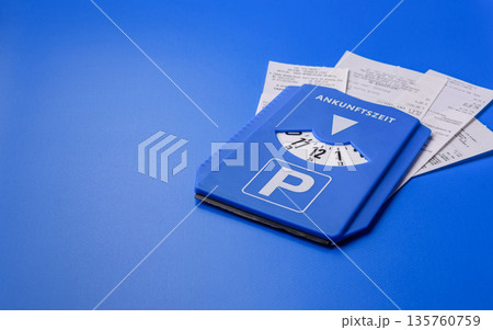 A parking disc, permit, or ticket for measuring time and paying municipal services. A parking disc 135760759